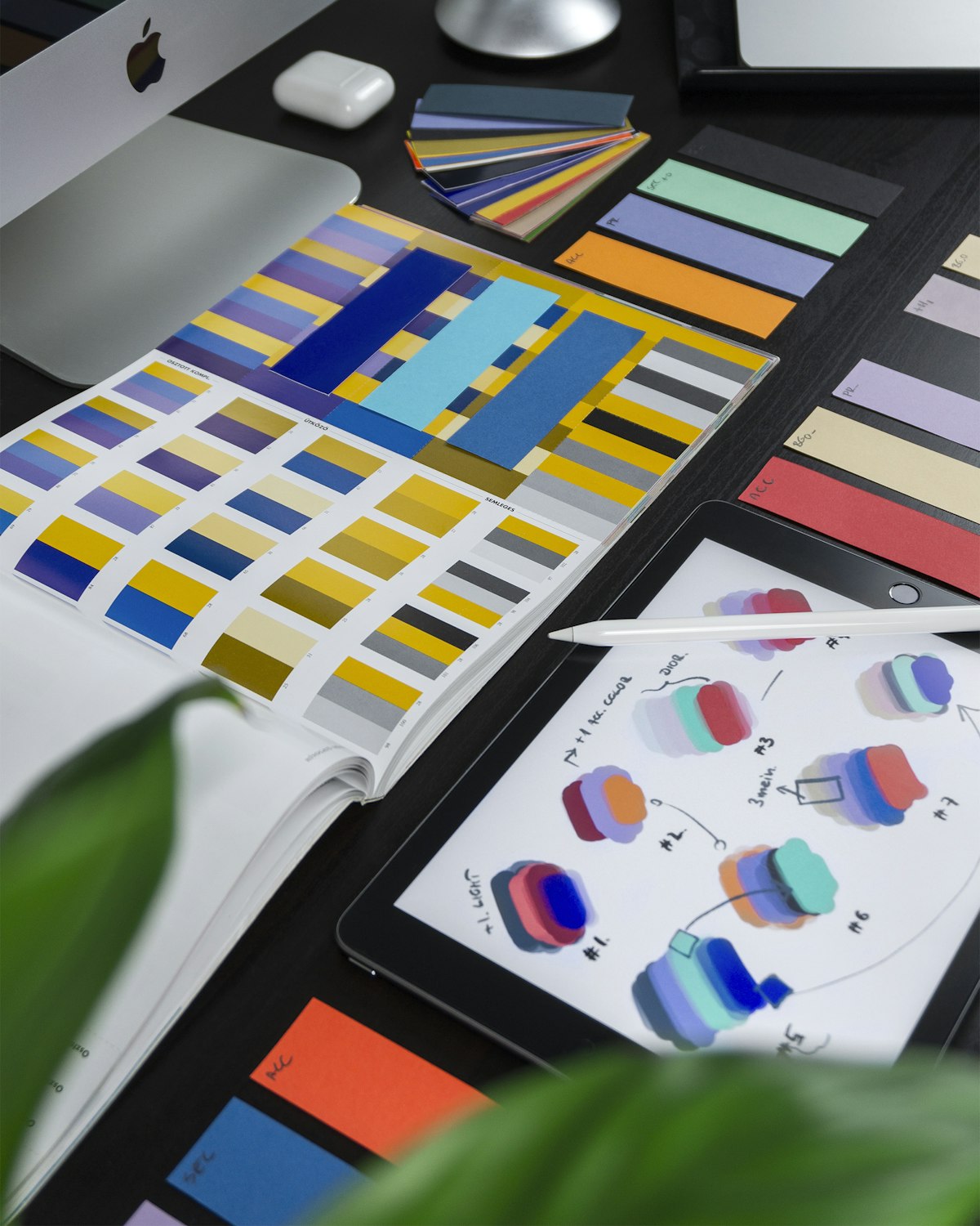 Design tools and color swatches on a studio desk